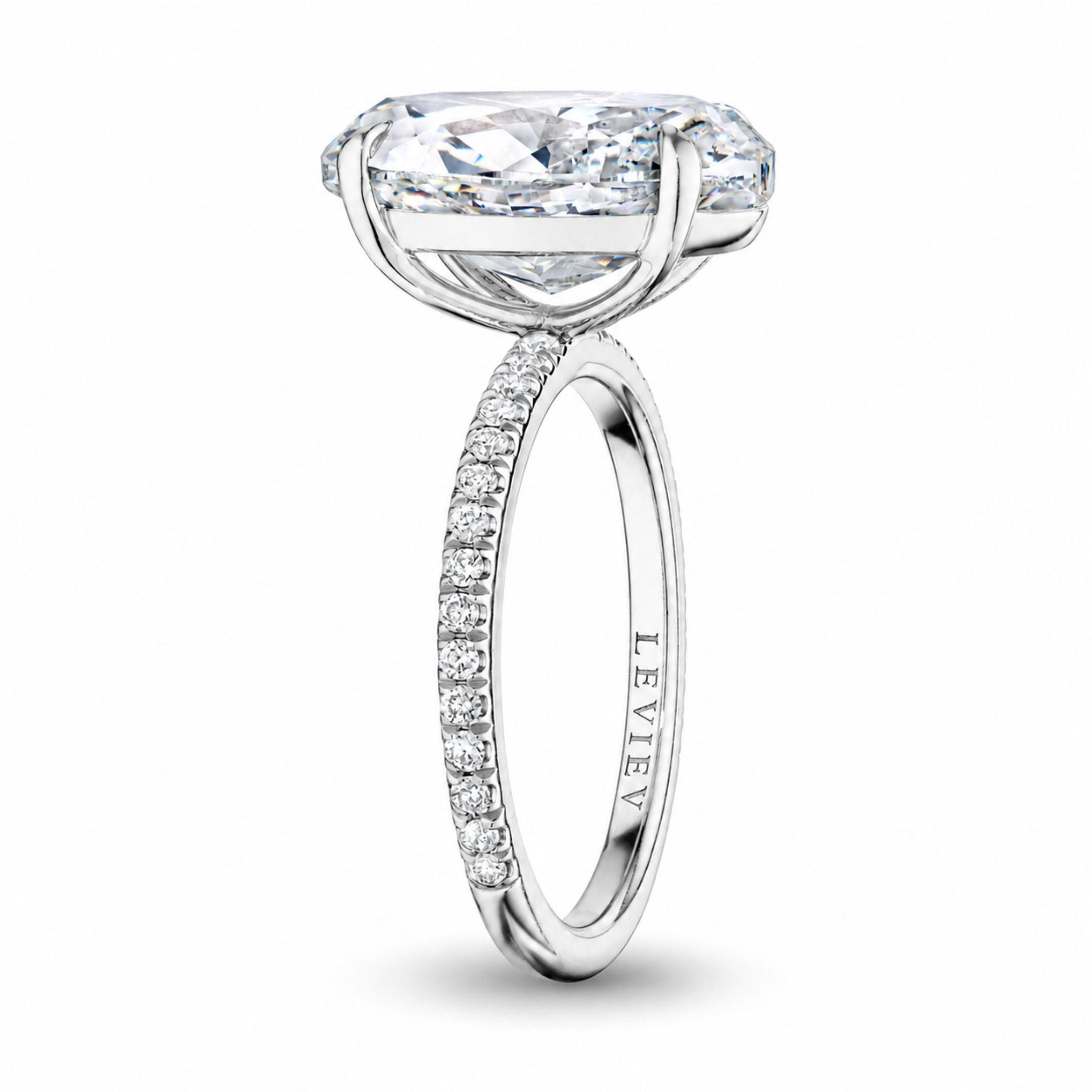Leviev engraved platinum oval diamond ring side view with split-prong basket