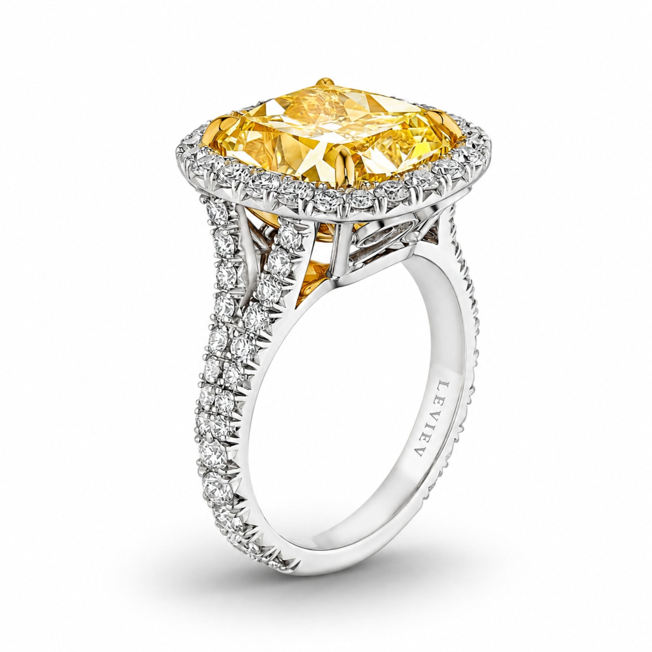 Side view of Leviev Aurelia Solitaire Ring showing split shank, engraved LEVIÉV logo, and yellow gold prongs on white gold band