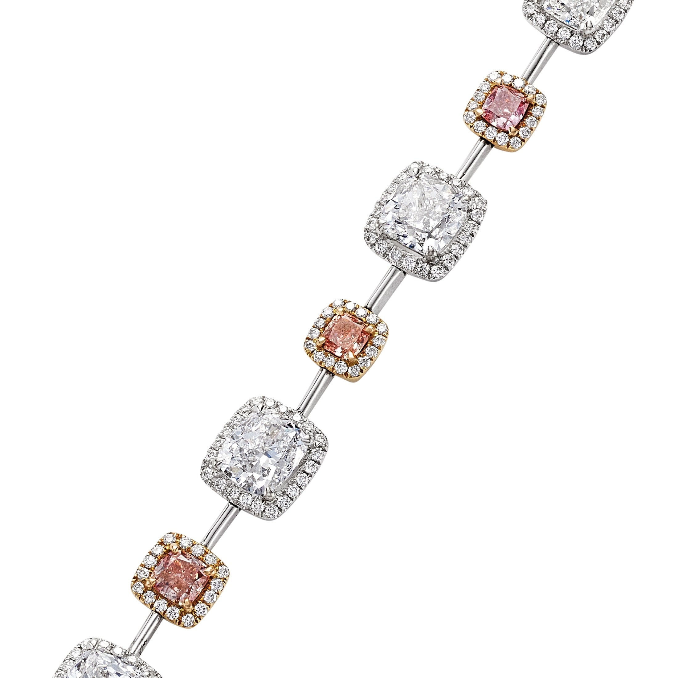 Close-up of cushion-cut diamond halos and square pink diamond stations on Leviev bracelet