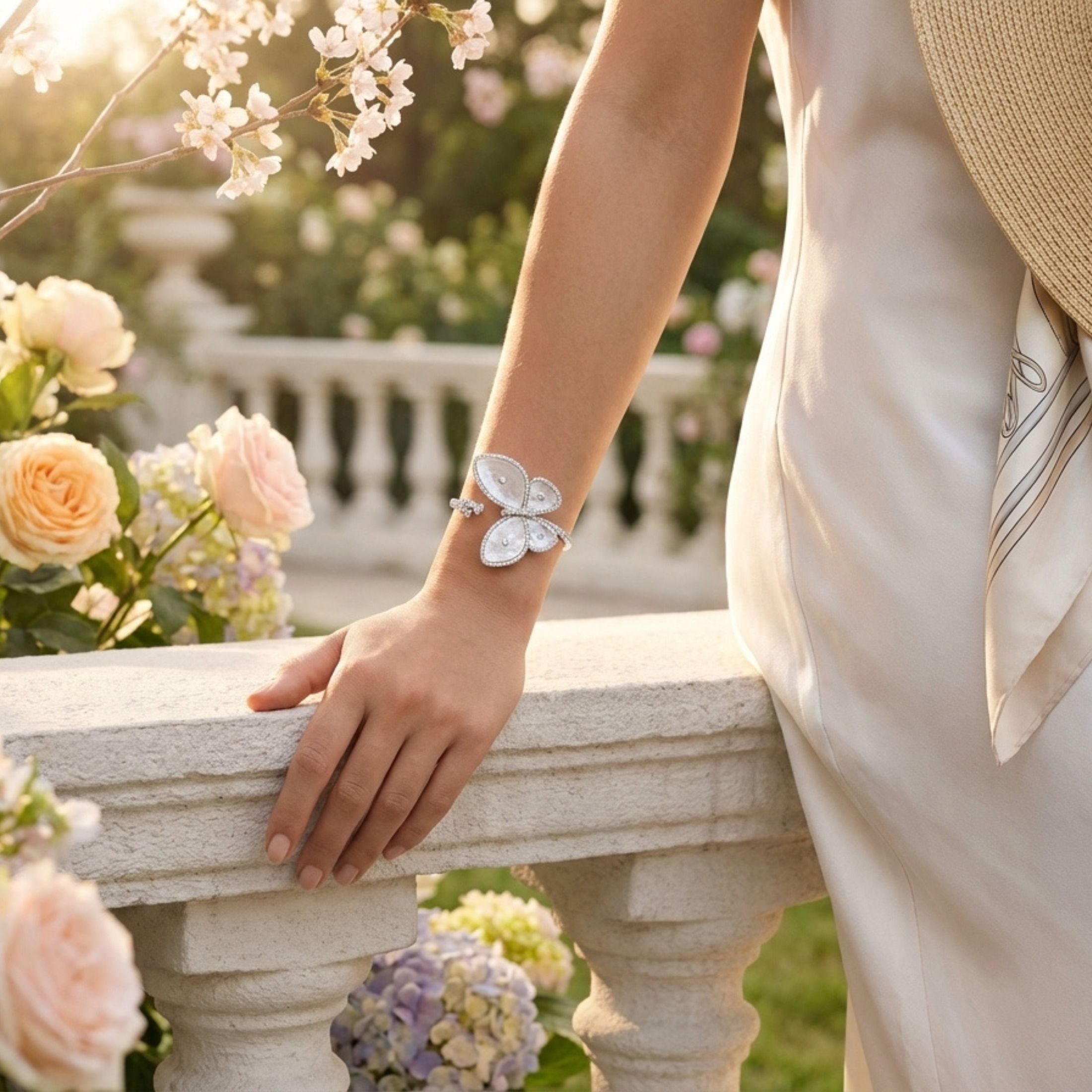 18K white gold butterfly bangle with mother of pearl wings and 2.90 carat diamonds on wrist