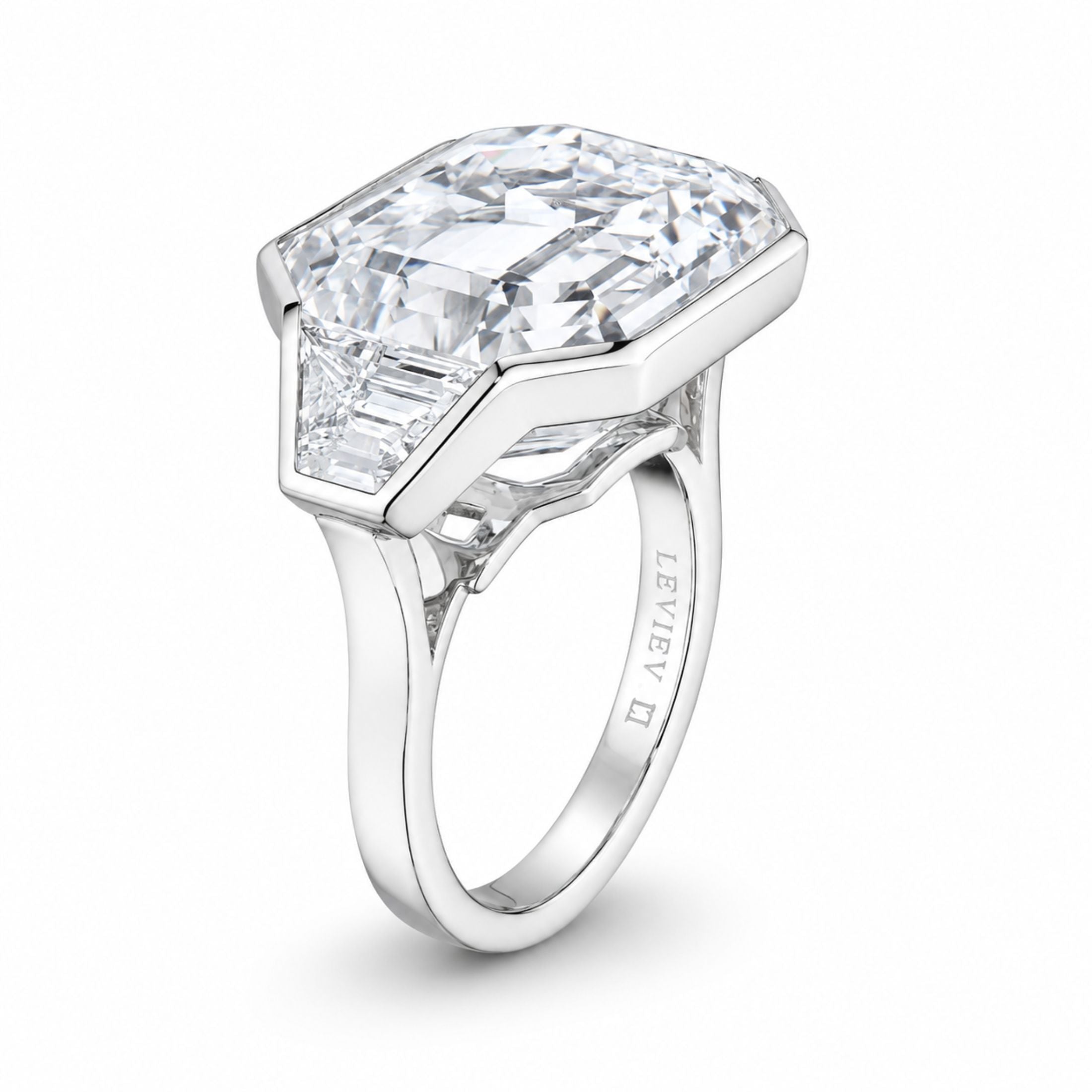 Leviev III platinum three-stone diamond ring side view showing engraved inner band