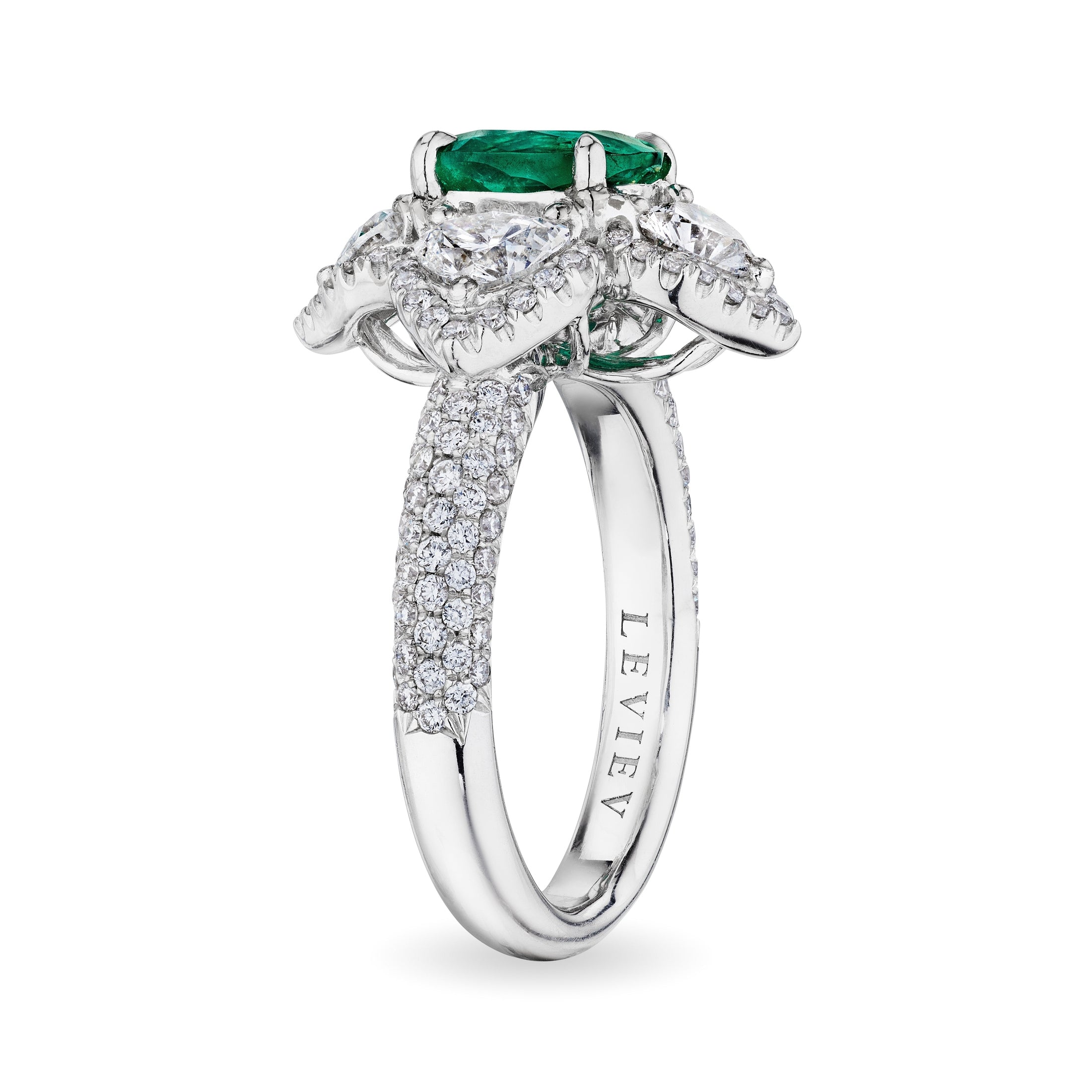 Side view Leviev platinum emerald ring with engraved brand name and eternity diamond shank