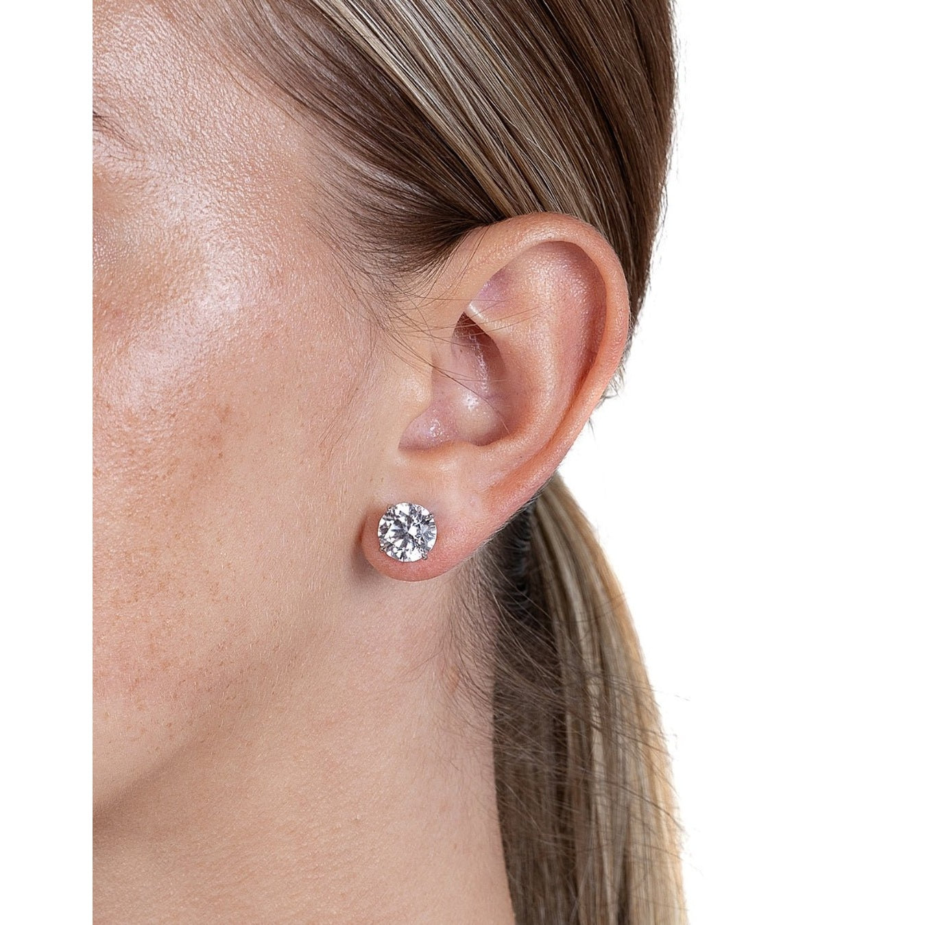 Leviev 6 CT diamond stud earrings on ear with platinum setting