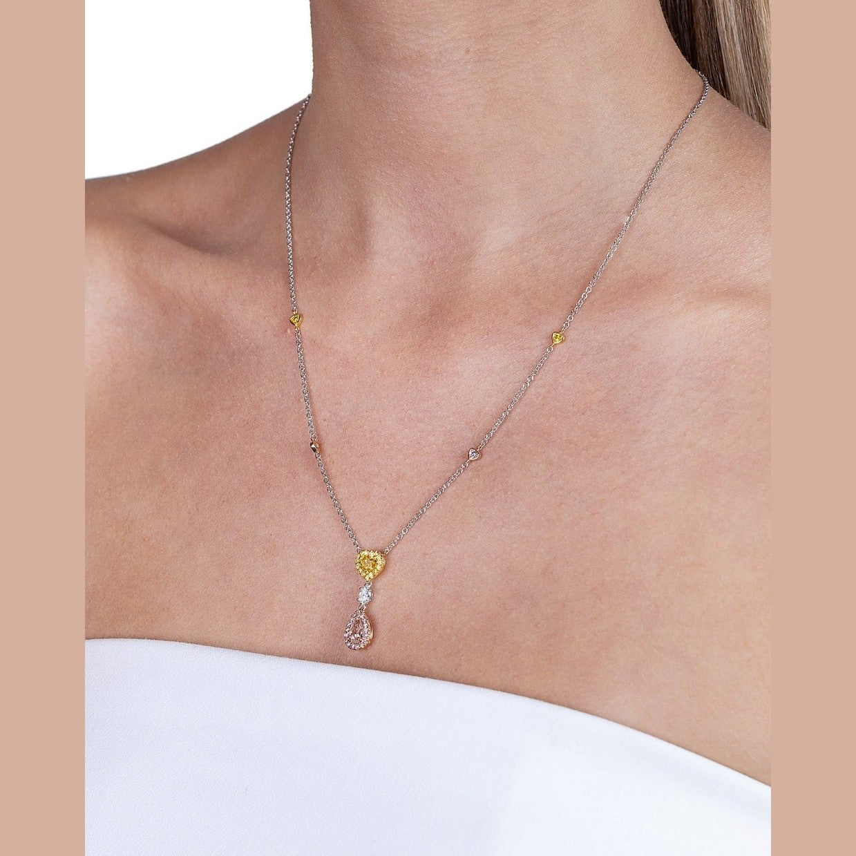 Heart yellow diamond and pear pink diamond pendant necklace on platinum chain