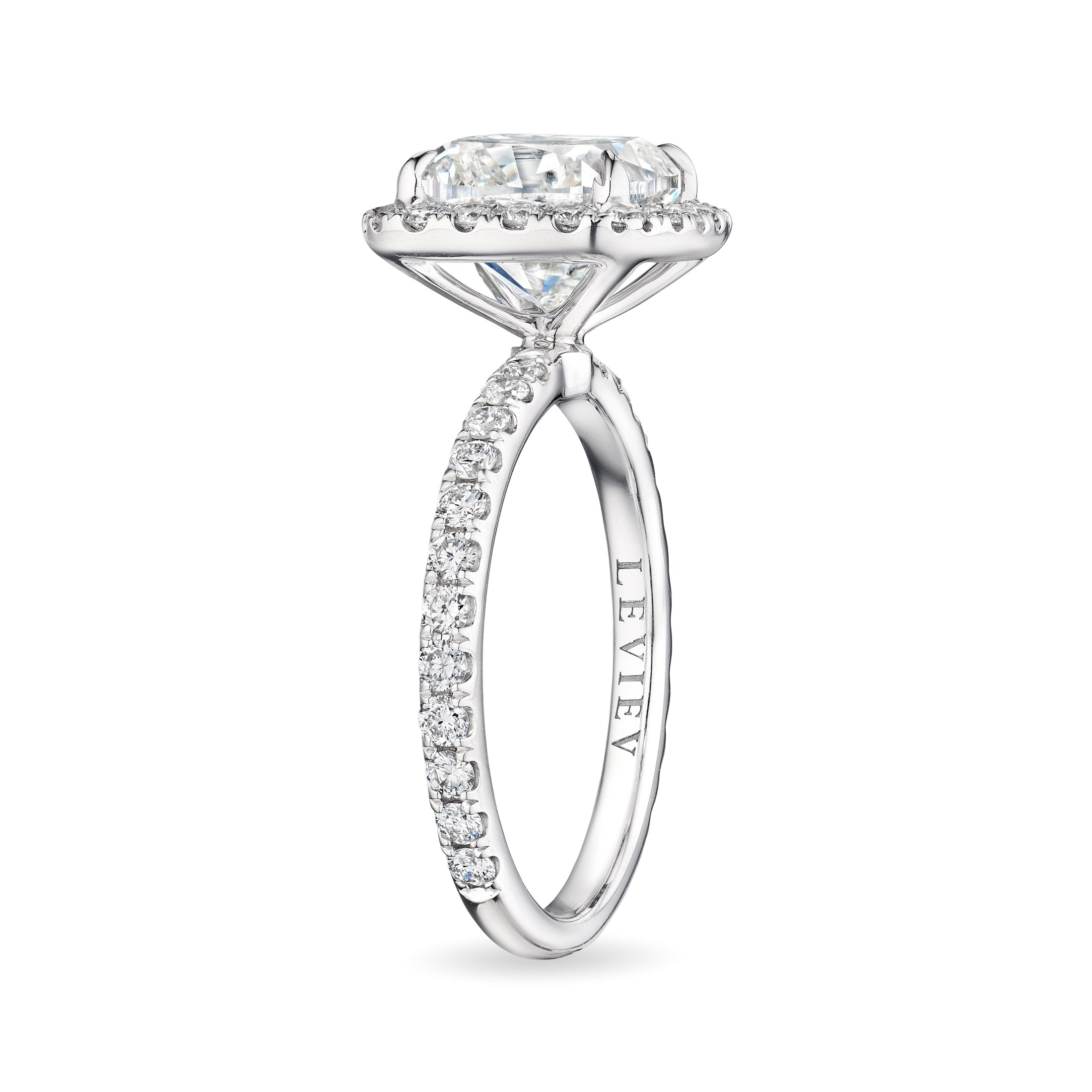 Leviev Ella cushion cut diamond halo ring side view with channel-set shoulders and engraved shank