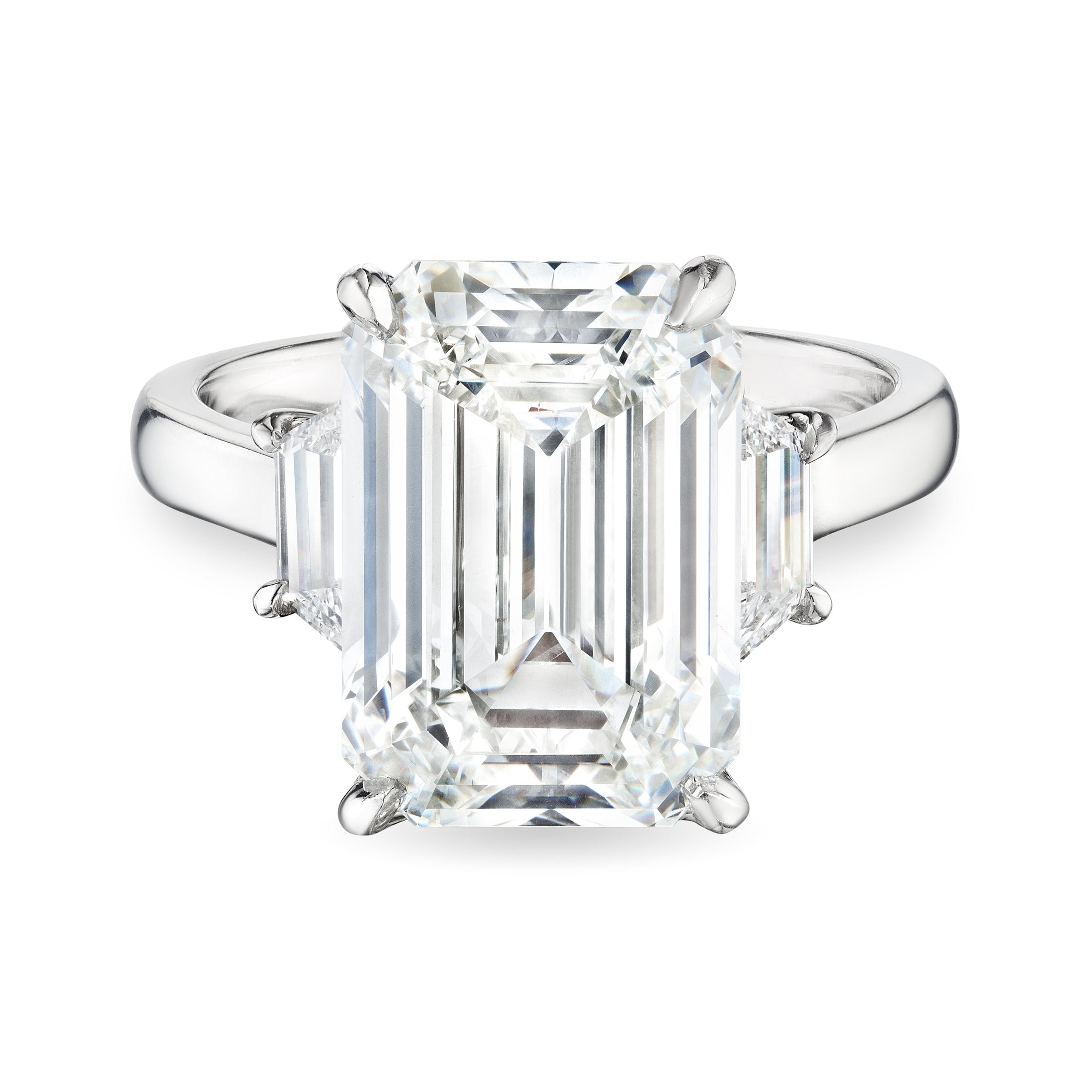 Top view Leviev emerald cut diamond ring with symmetrical trapezoid accents and polished platinum band