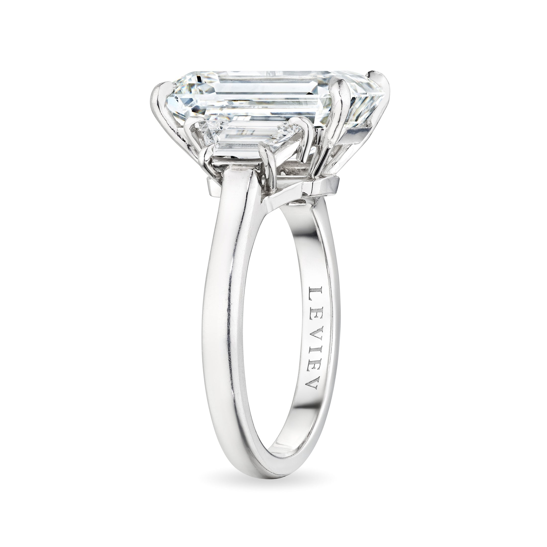 Leviev platinum emerald cut diamond ring side profile with engraved LEVI band and trapezoid shoulder stones