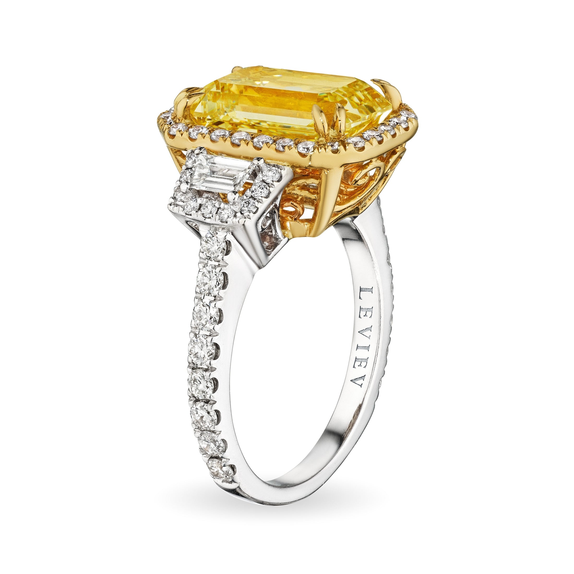 Leviev two-tone gold emerald cut fancy light yellow diamond ring with white gold split shank and baguette accents