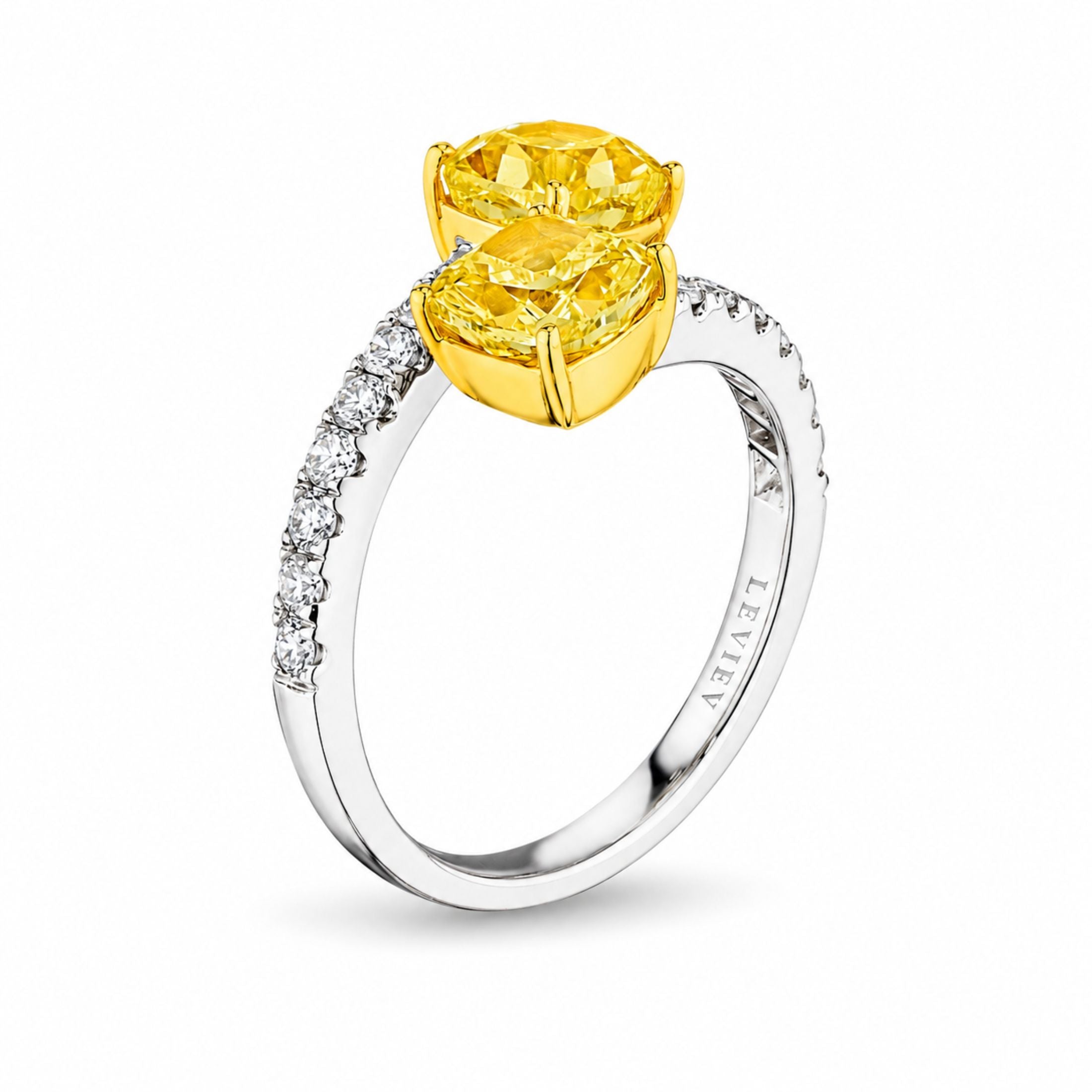 Leviev engraved bypass ring side view showing stacked yellow marquise diamonds on white gold pavé band
