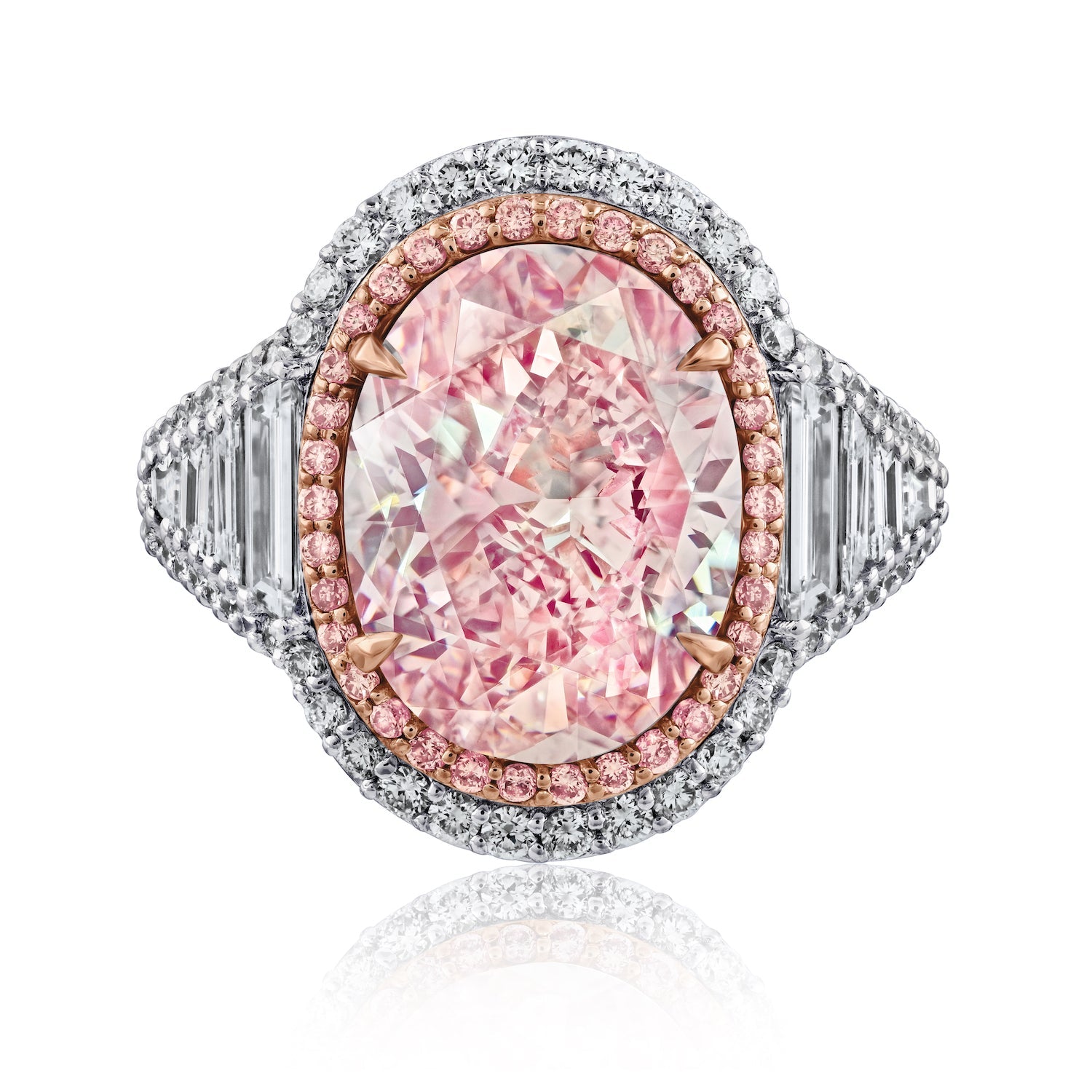 Fancy pink oval cut diamond ring with tapered baguettes and double halo in 18K white gold