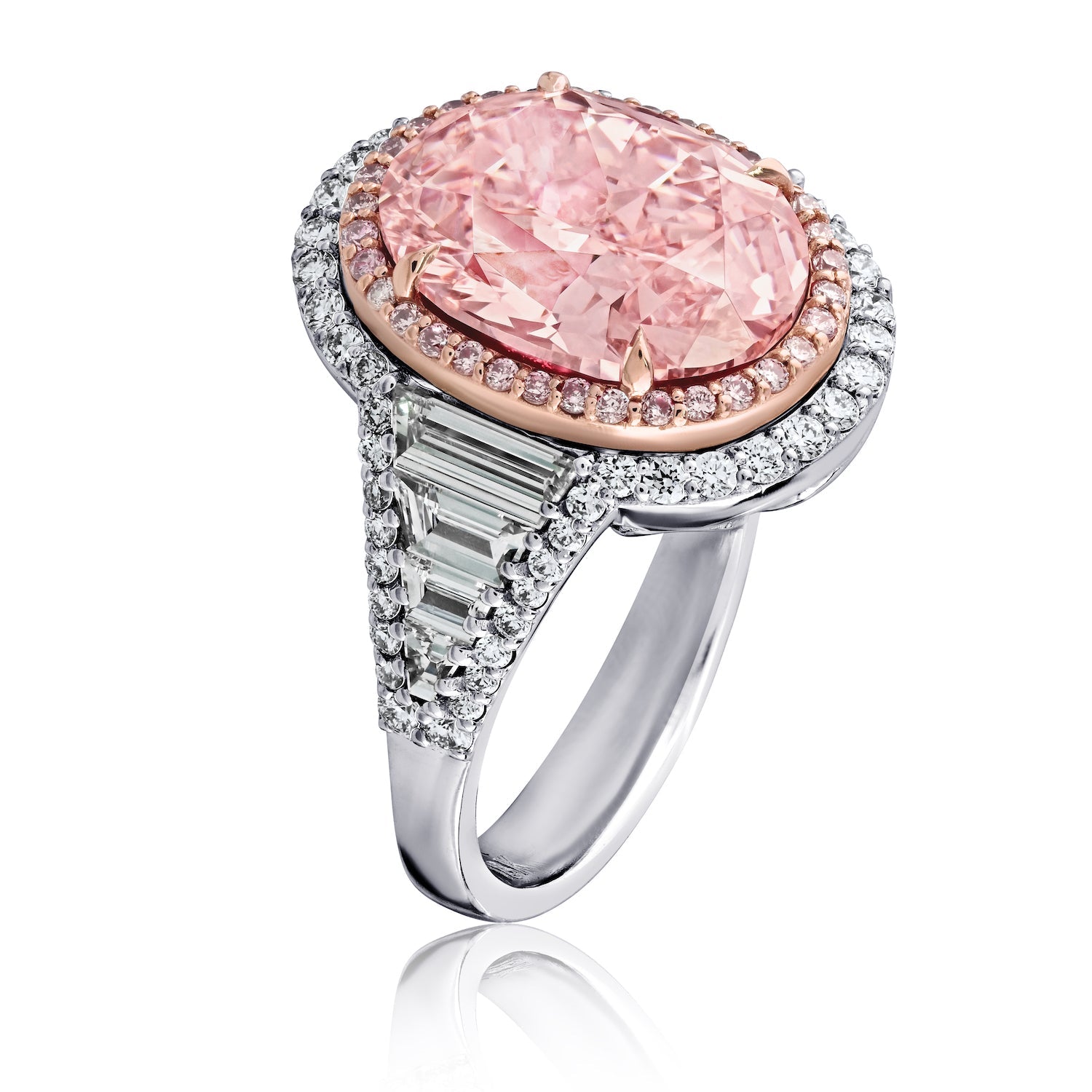 Side profile of fancy pink oval diamond ring showing rose gold prongs and pavé band detail