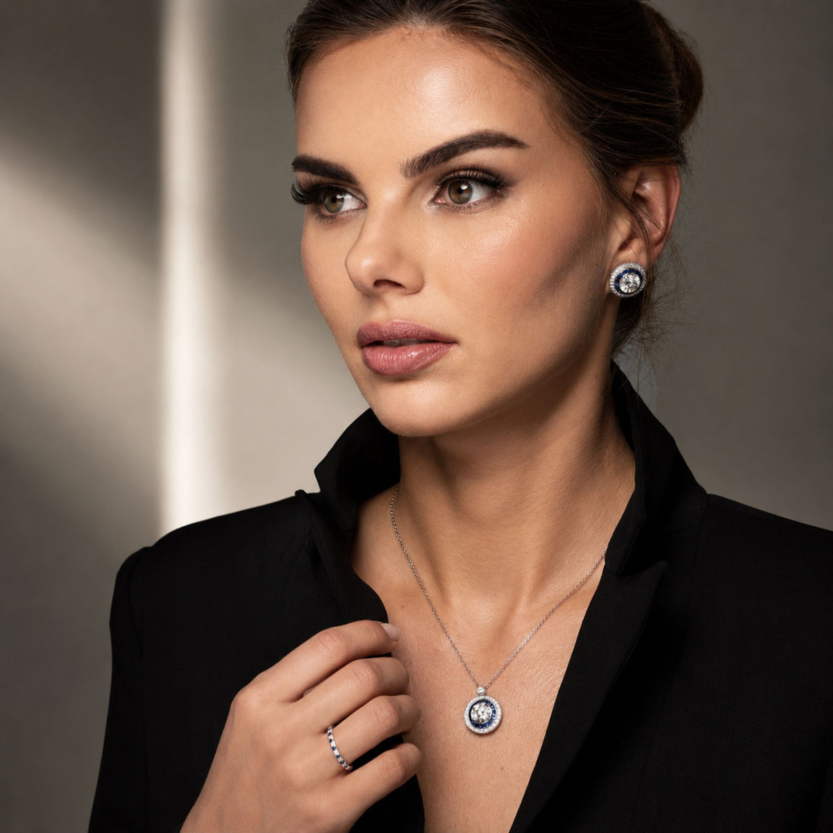 Woman wearing Leviev Geneviève 3.60ct Diamond Sapphire Halo Necklace with matching earrings and ring
