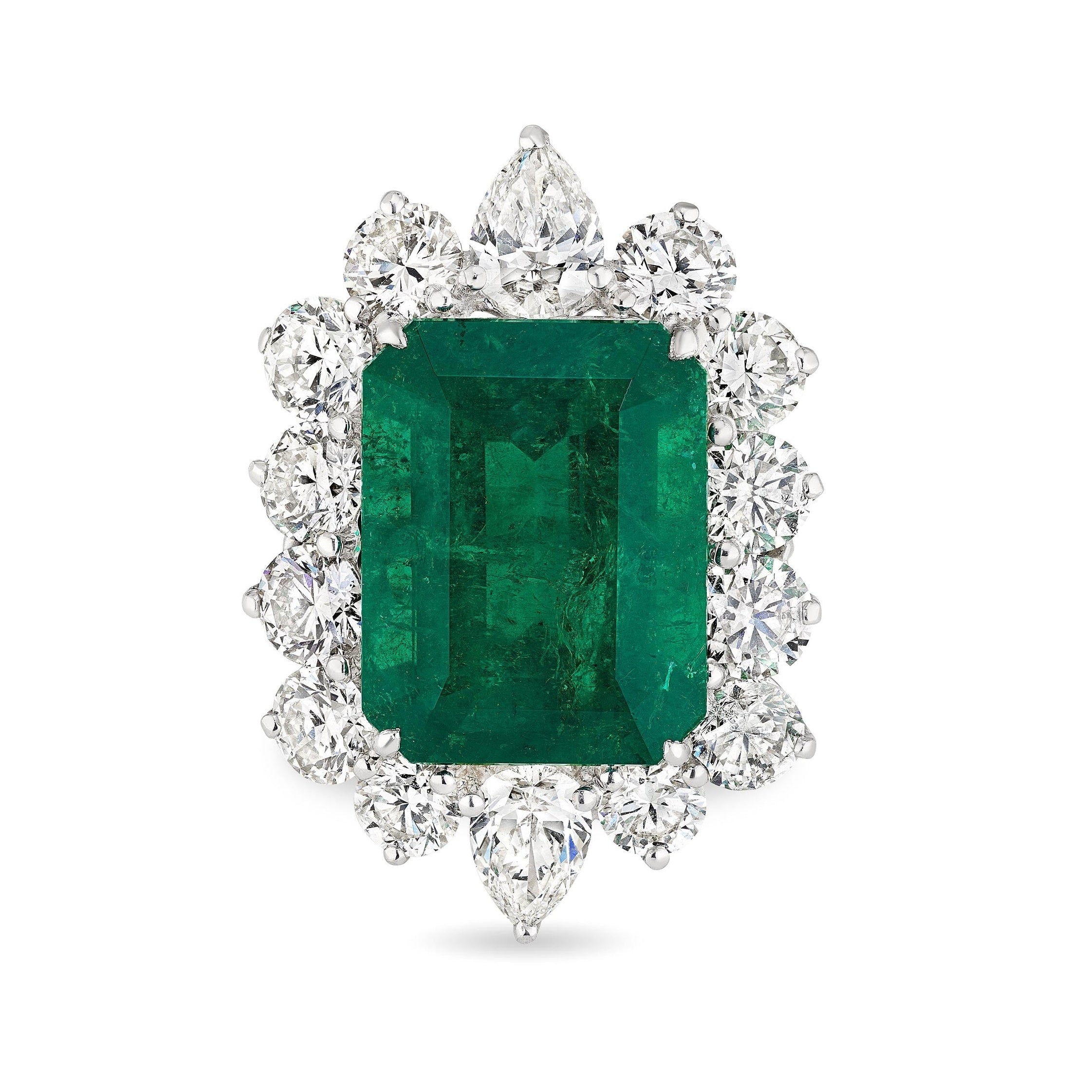 Grove Crown platinum ring with emerald cut green stone and diamond halo