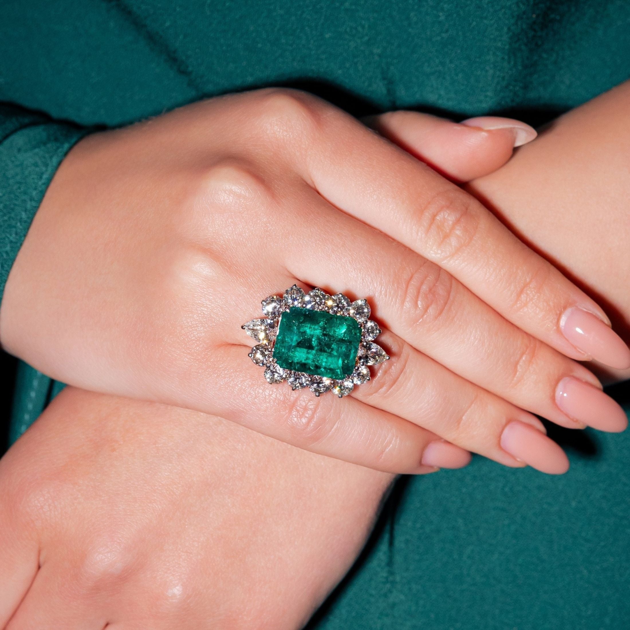 Close-up of Leviev emerald diamond ring showing gemstone facets