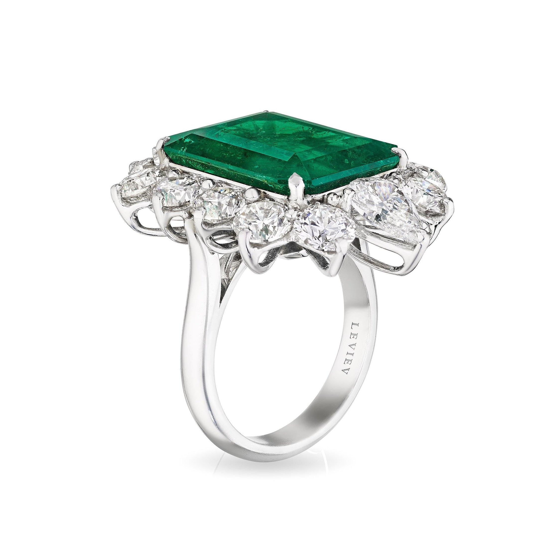 Side view of engraved Leviev platinum ring with emerald and diamonds