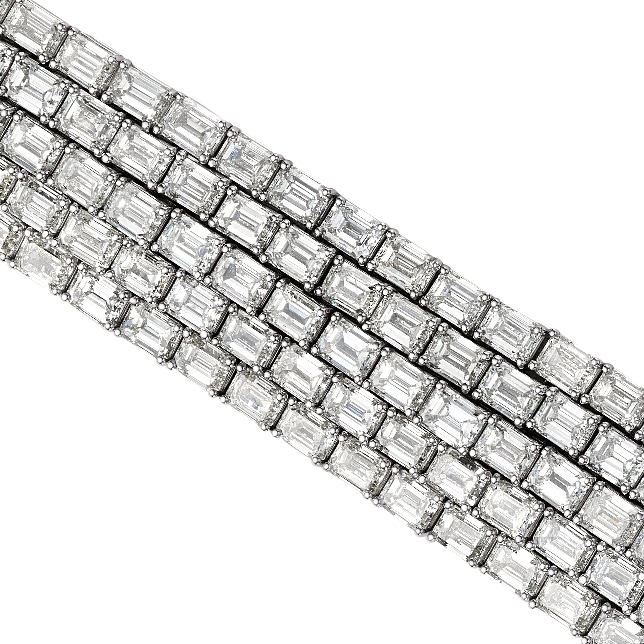Close-up of precision-set emerald cut diamonds with milgrain detailing on Leviev white gold bracelet