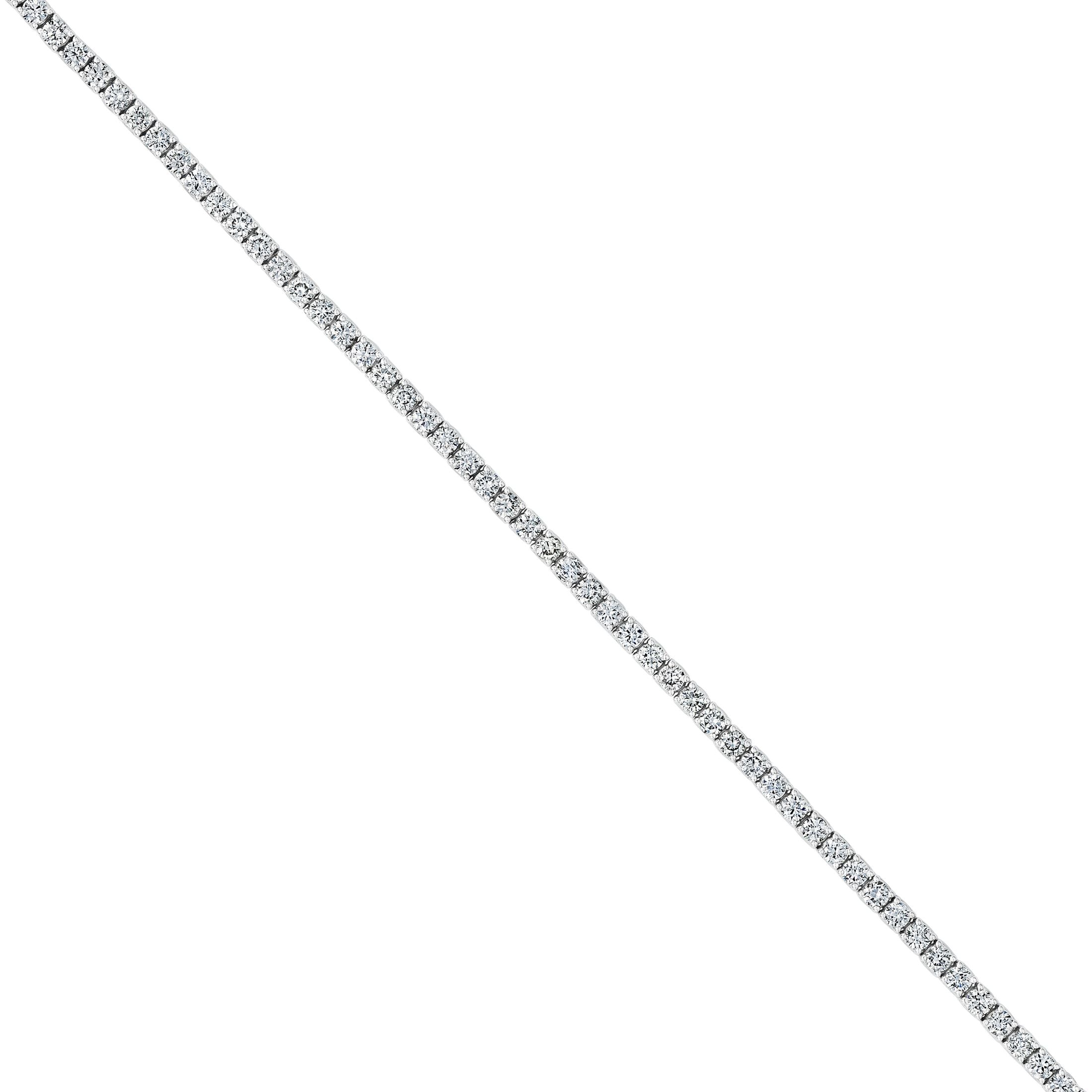 Continuous row of round brilliant diamonds on 18K white gold band