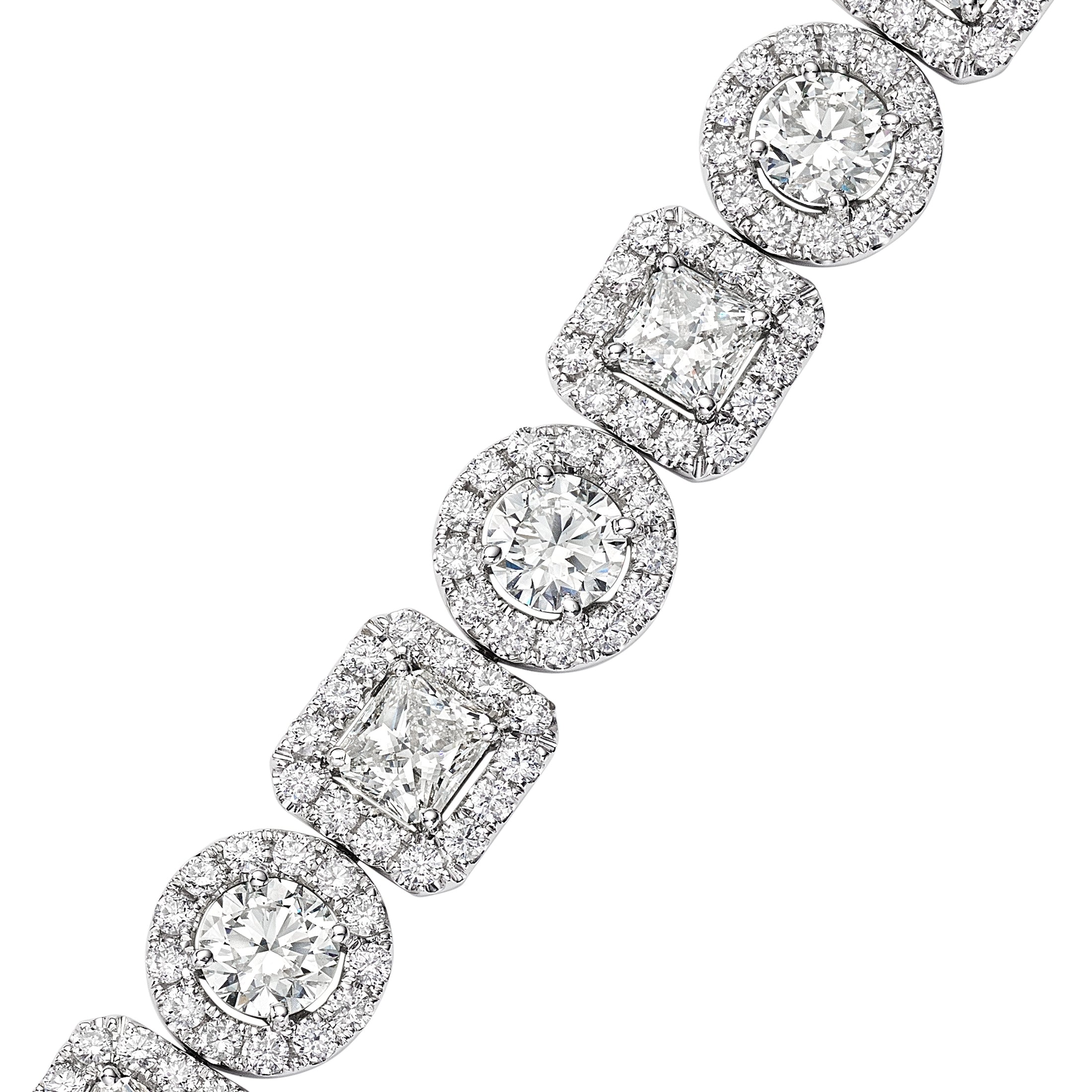 Close-up of Le Pavillon diamond station bracelet showing alternating round and radiant cut diamonds with pavé halos in 18K white gold