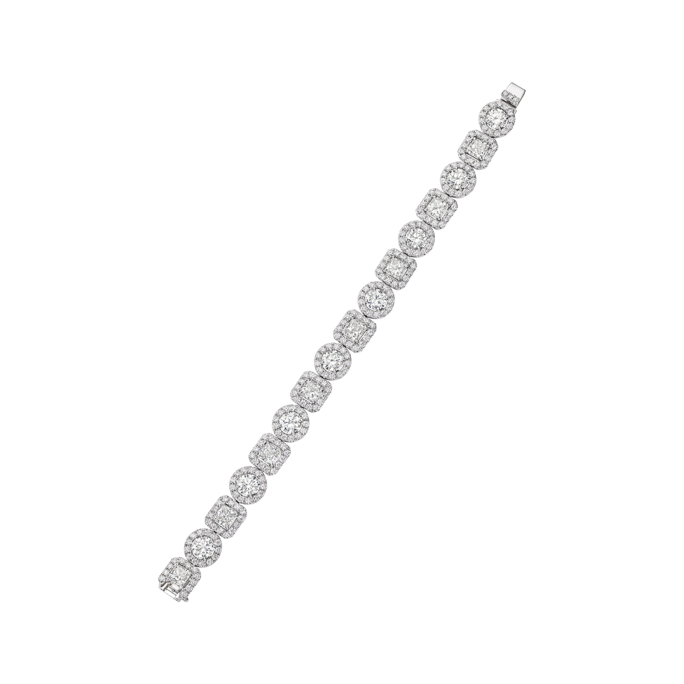 Full view of Le Pavillon 18K white gold diamond bracelet with tapered design, alternating round and radiant cut stones, and continuous pavé halo