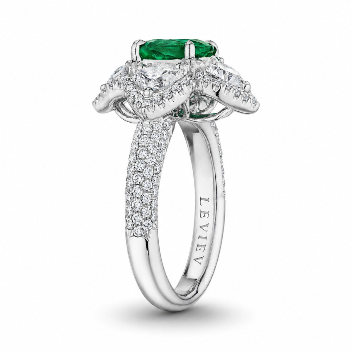 Leviev engraved platinum emerald ring side profile showing sculpted diamond petals and polished shank