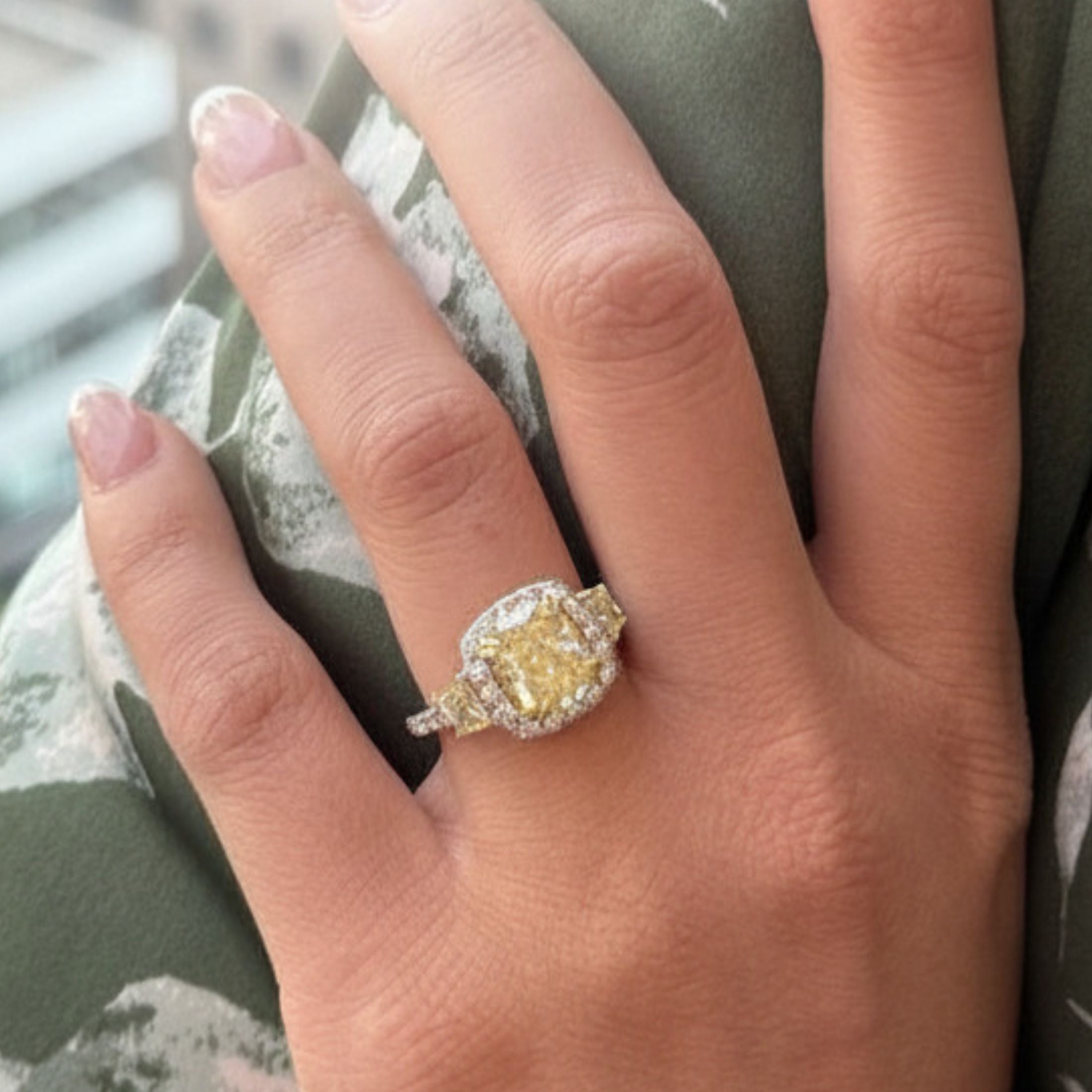 Fancy yellow diamond statement ring worn on hand