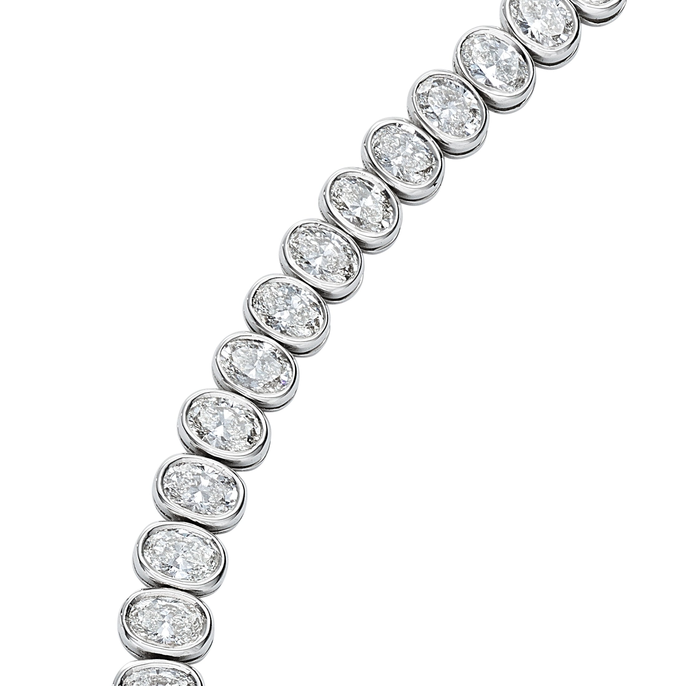 Close-up of 6.74 carat oval cut diamonds on Leviev white gold tennis bracelet