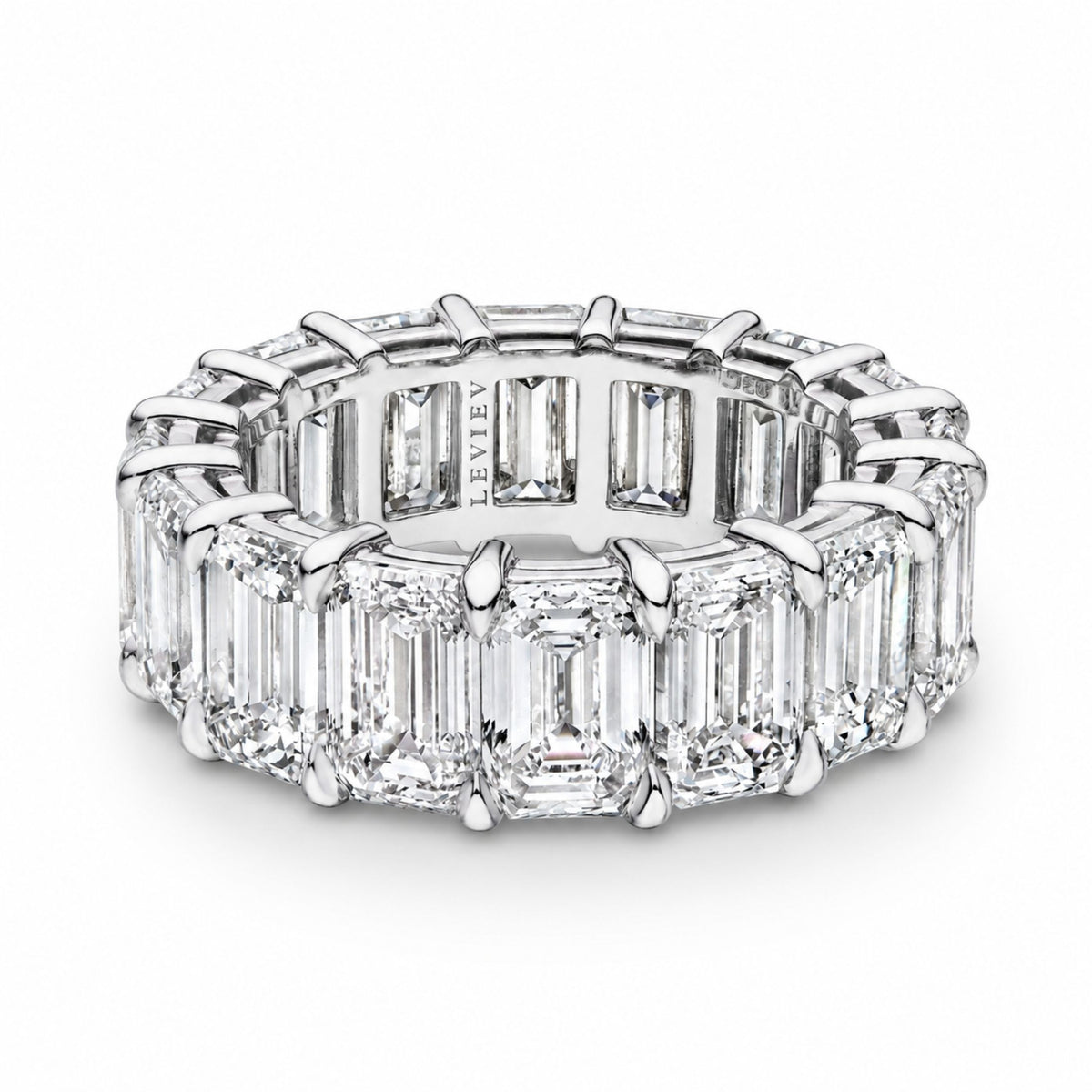 Top view of Leviev platinum eternity ring with seamless emerald cut diamond circle and engraved interior
