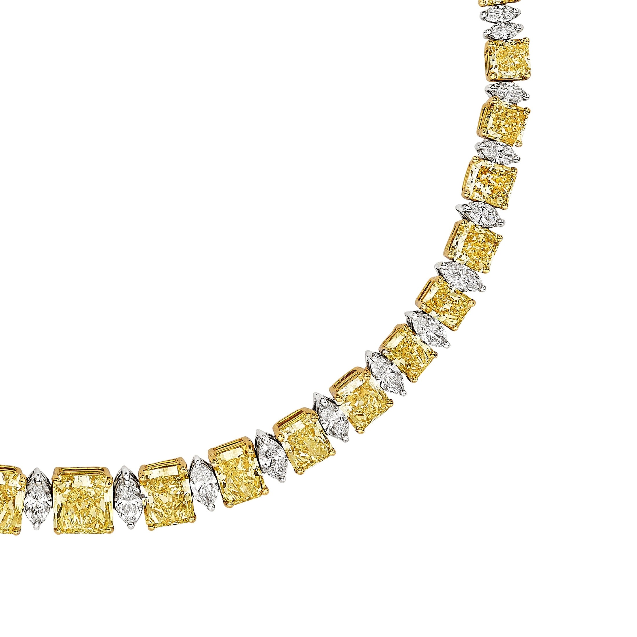 Close-up of Luminary Veil necklace showing step-cut yellow diamonds and marquise white diamonds in dual-tone metal settings