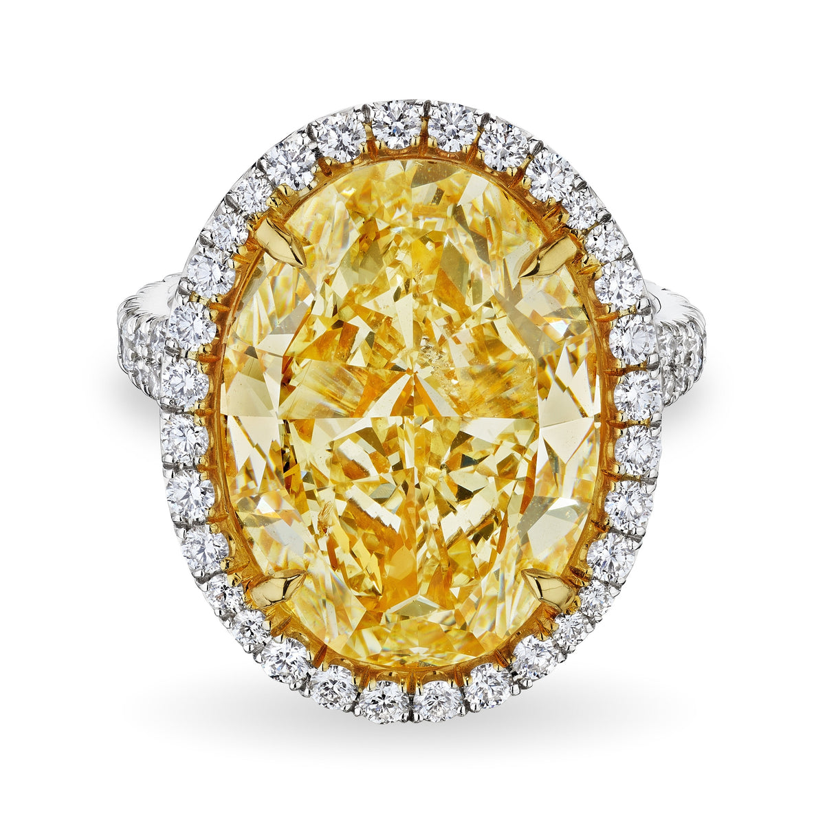 Oval fancy light yellow diamond ring 10.68 CT with white diamond halo and split shank in 18K white gold