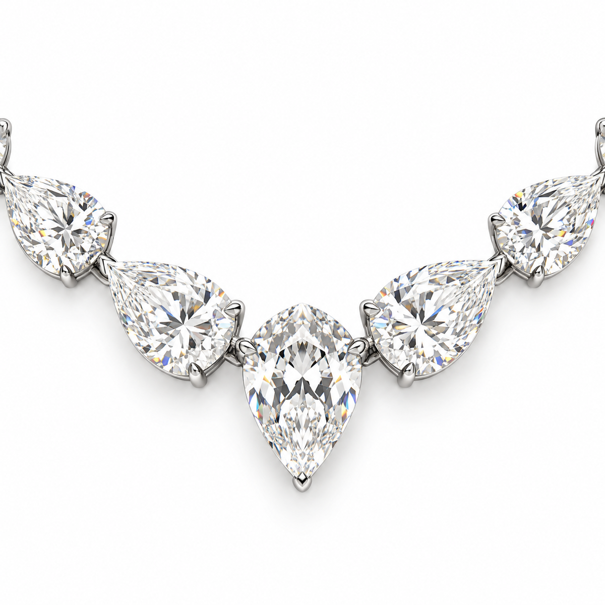 A close-up of a diamond necklace featuring five pear-cut diamonds in a silver-toned setting, arranged symmetrically on a plain white background.