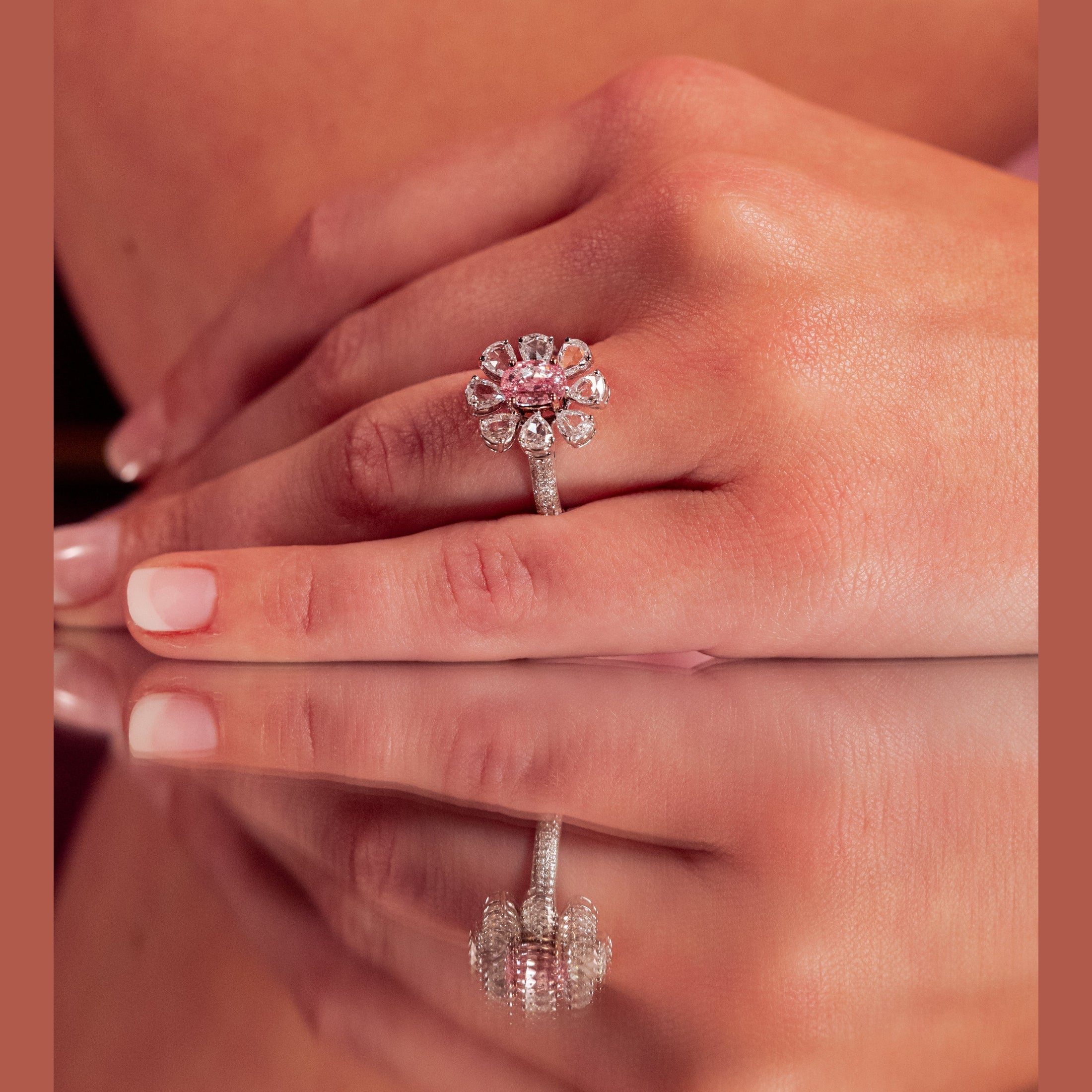 Leviev pink oval diamond flower ring worn on hand showing fit and sparkle