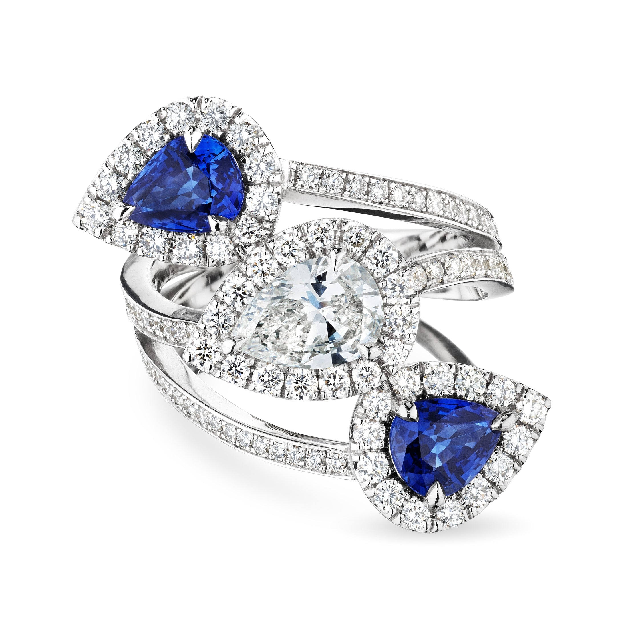 Set of three Leviev Reko bypass rings showing stacked symmetry with royal blue sapphires and double diamond halos in white gold