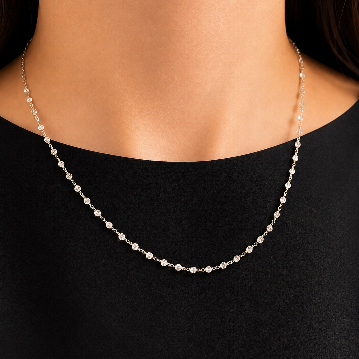 18K white gold diamond station necklace with round brilliant-cut diamonds on model