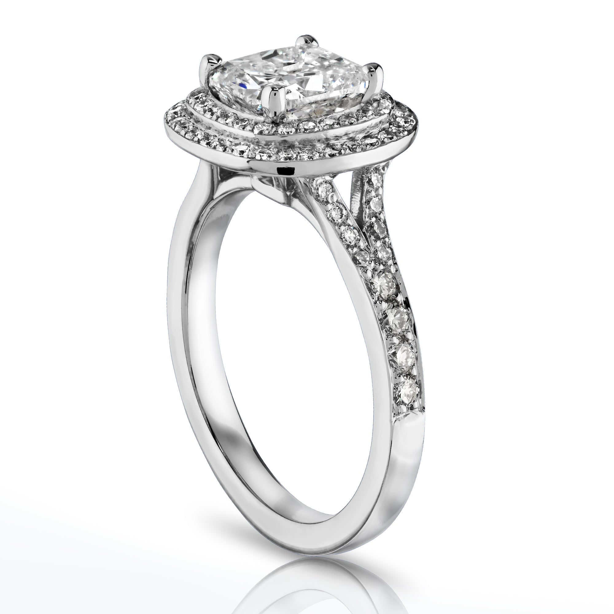 Side view of 14K white gold cushion cut diamond double halo ring with split shank and channel set band