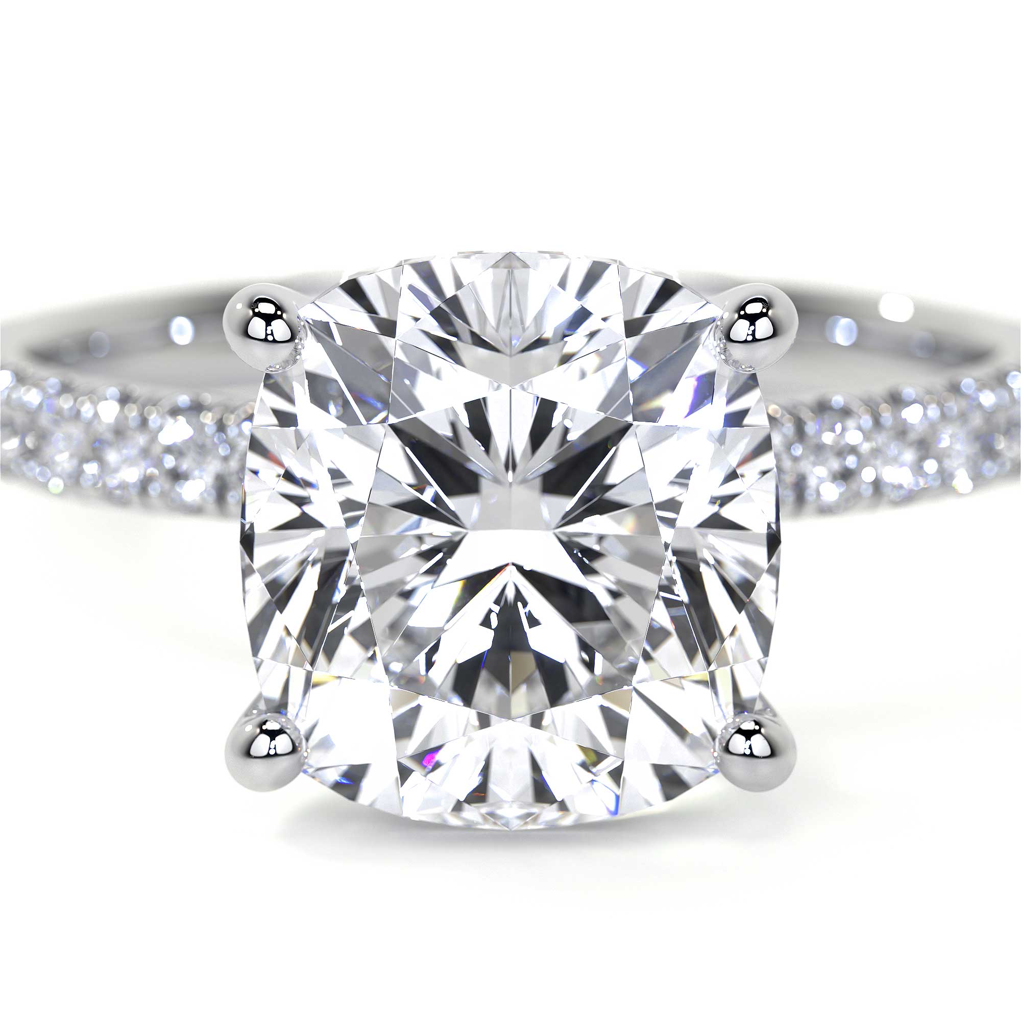 Close-up of 18K white gold cushion cut diamond ring showing four prong setting and sparkling pavé details