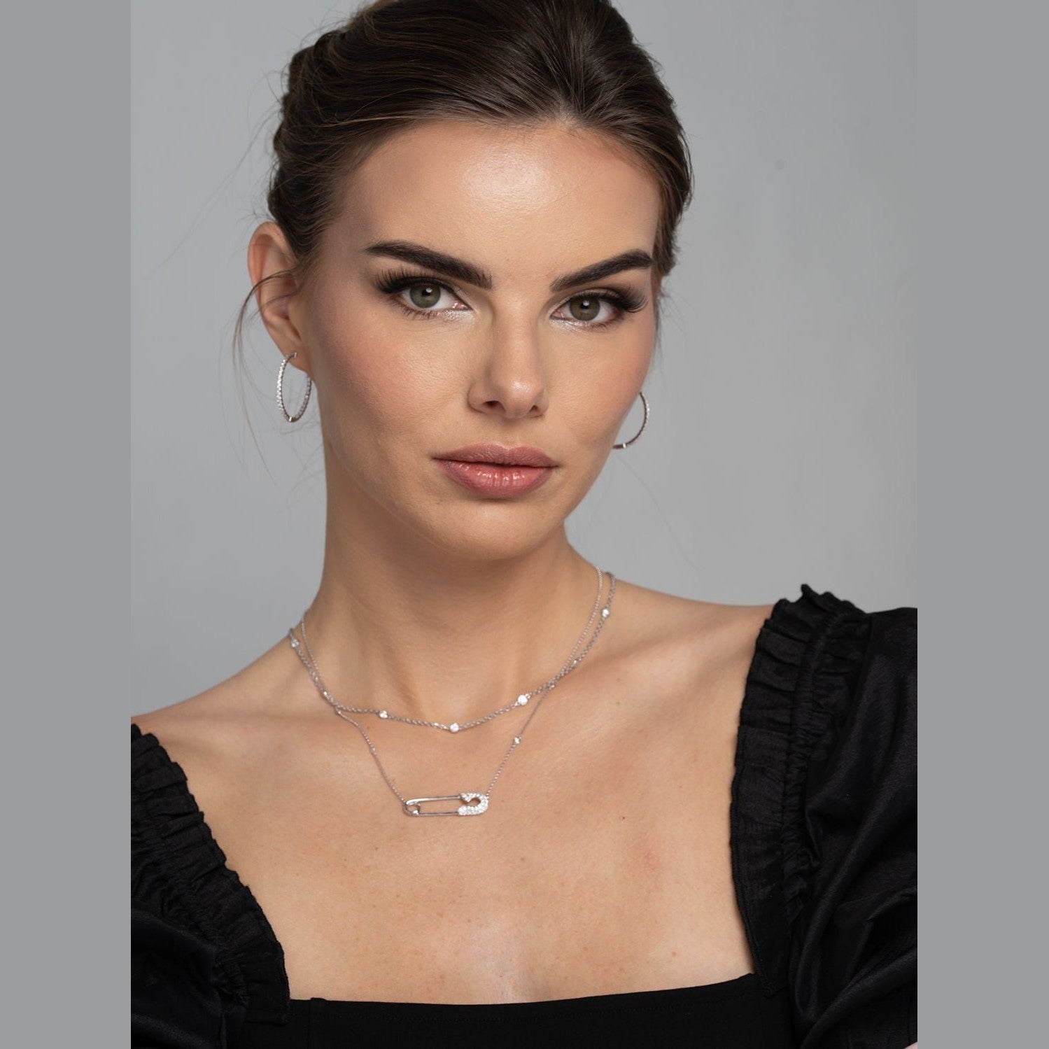Woman wearing Leviev diamond by the yard layered necklace