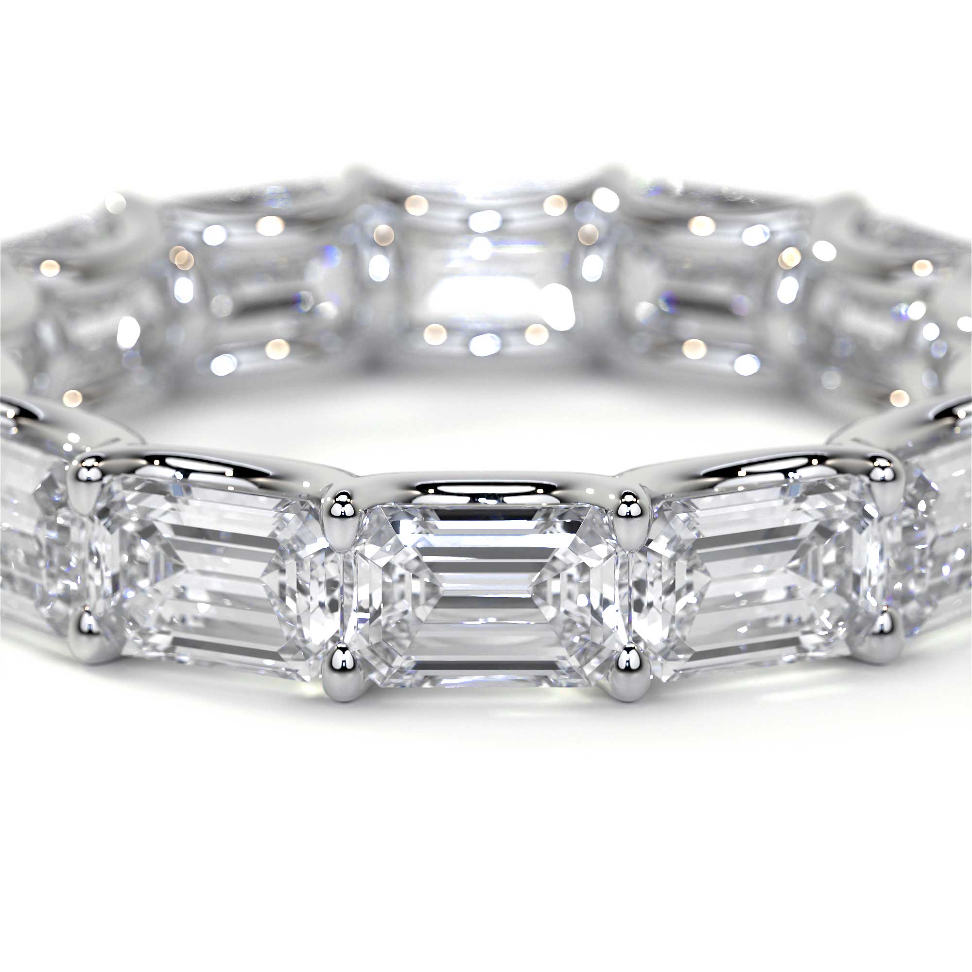 Close-up of Leviev platinum ring showing emerald cut diamond east to west layout