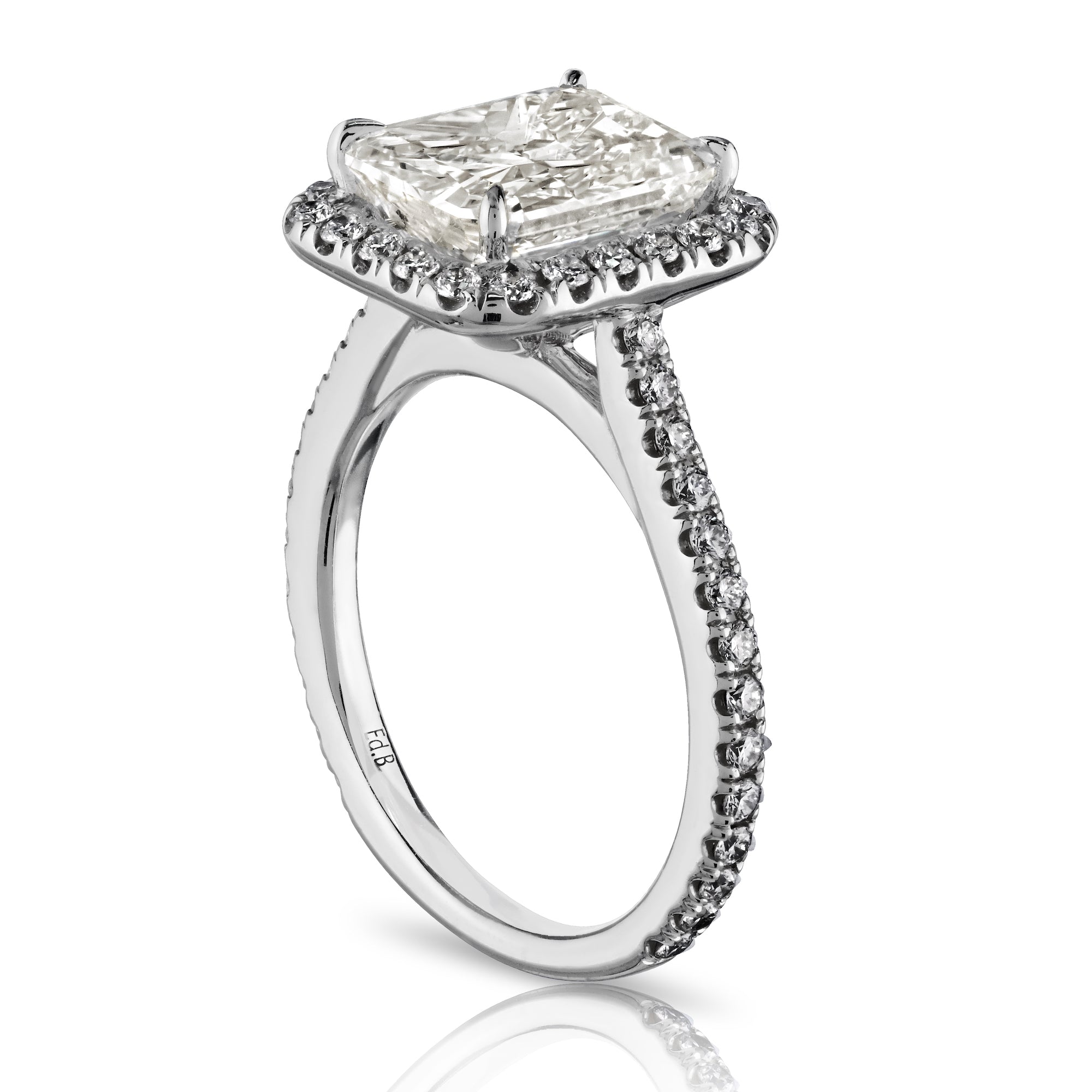 Side view of radiant cut diamond ring showing cathedral setting and engraved hallmark