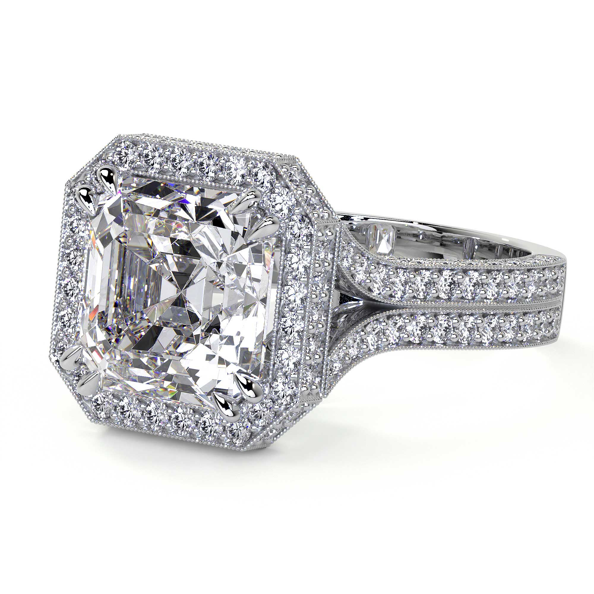 Platinum emerald cut diamond ring split shank milgrain detail close-up